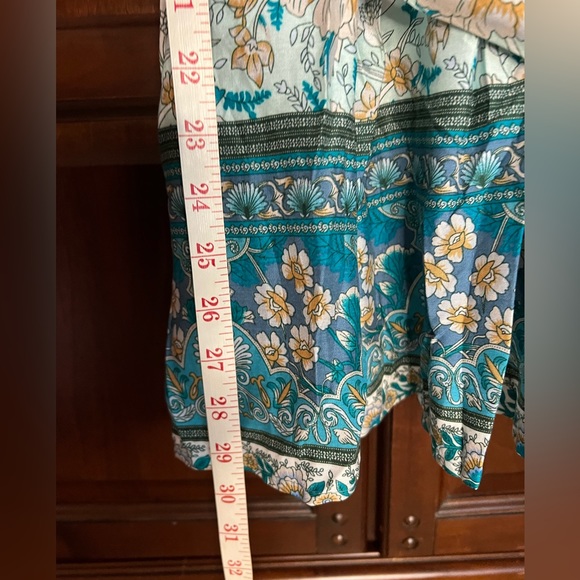 Beautiful BloomChic teal bandana print top with flutter sleeves and a tie belt. - Picture 6 of 7